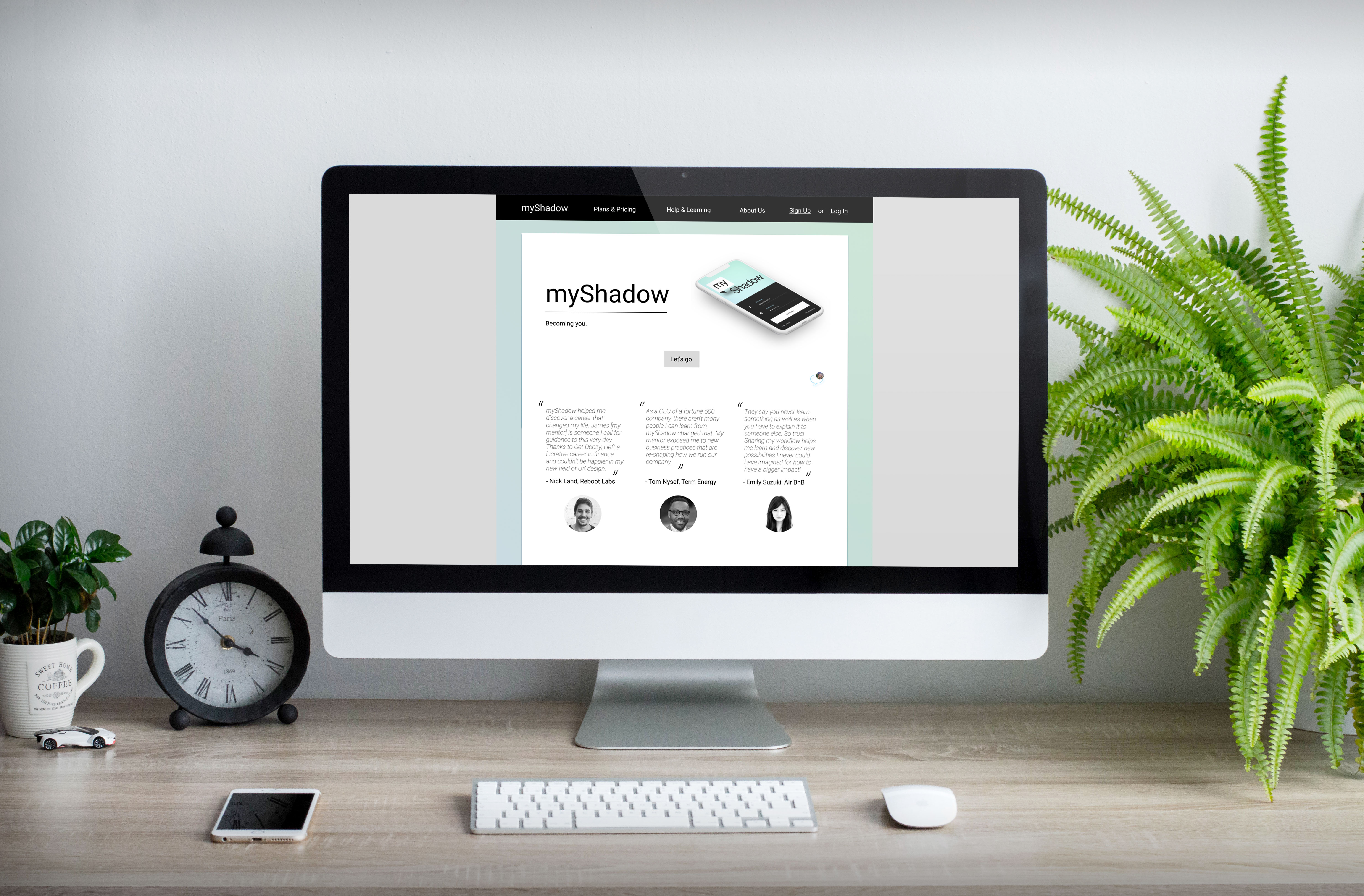 a mockup of an apple imac product with a montage of our myshadow homepage on the screen